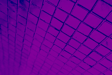 Beautiful closeup textures abstract tiles and black and purple color glass pattern wall background and art wallpaper 