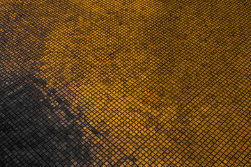 Beautiful closeup textures abstract tiles and black gold and yellow color glass pattern wall background and art wallpapers