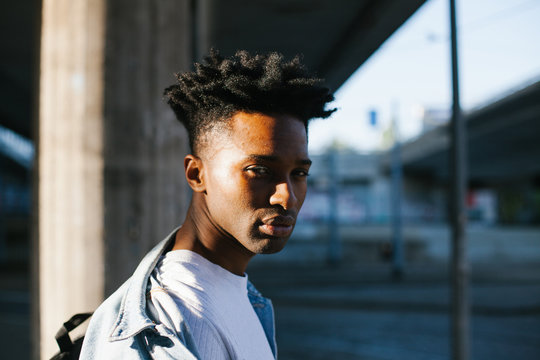 Portrait Of A Handsome Young Man Looking At Camera