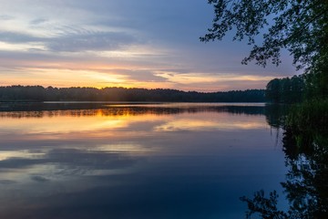 Fototapeta na wymiar Lake during cloudy sunrise