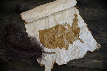 map of united states of america on vintage paper with old pen on the wooden texture desk