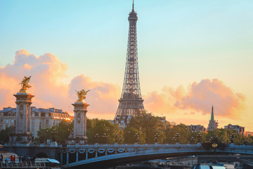 Eiffel Tower at sunset in Paris, France. Romantic travel background. Eiffel tower is traditional symbol of paris and love. - obrazy, fototapety, plakaty