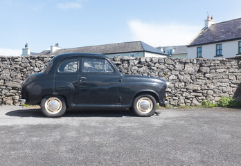Naklejka premium Old British classic car in British village