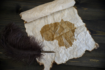 map of lithuania on vintage paper with old pen on the wooden texture desk