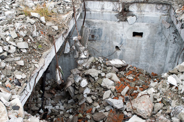 Blockage of bricks, pieces of concrete and other construction debris of the destroyed building. The view from the top.