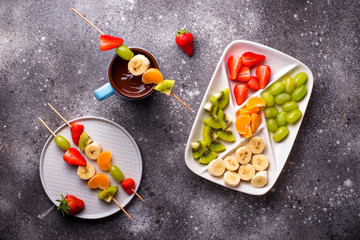 Sweet chocolate fondue with fruits