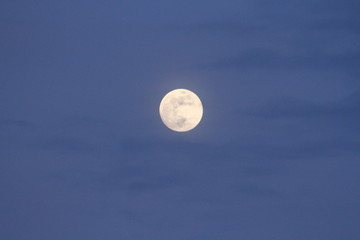 Full Moon on Blue Sky with Clouds at Dusk