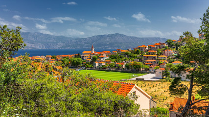 Obraz premium Postira on Brac island skyline view, Dalmatia, Croatia. Postira on Brac island skyline view, Dalmatia, Croatia. Gorgeous view on village Postira on Brac island, Croatia.