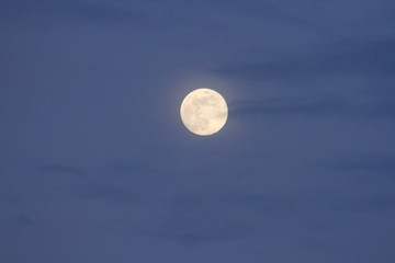 Full Moon on Blue Sky with Clouds at Dusk