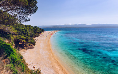 Zlatni Rat (Golden Cape or Golden Horn) famous turquoise beach in Bol town on Brac island, Dalmatia, Croatia. Zlatni Rat sandy beach at Bol on Brac island of Croatia in summertime.