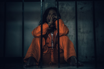 Portrait of women desperate to catch the iron prison,prisoner concept,thailand people,Hope to be...
