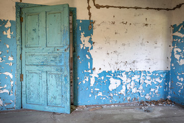 Blue interior of the kitchen of an abandoned house in Chernobyl exclusion zone in Belarus