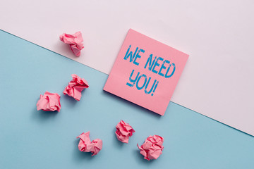 Text sign showing We Need You. Business photo showcasing asking someone to work together for certain job or target Note papers and stationary placed sideways on top of softhued backdrop