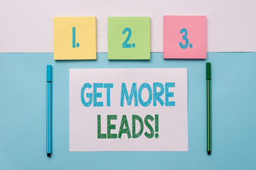Text sign showing Get More Leads. Business photo text initiation consumer interest or enquiry products or services Note papers and stationary placed sideways on top of softhued backdrop