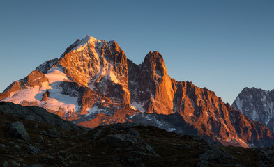 Last sunlight on the mountain peak Les Drus near Chamonix, France.