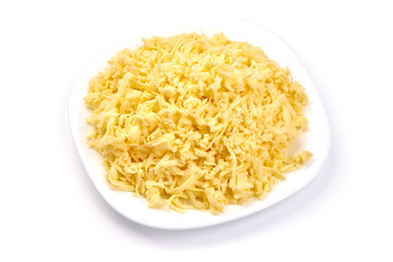 Grated cheddar cheese, close-up, isolated on white background