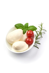 Bowl of traditional Italian mozzarella balls, top view, isolated on white background