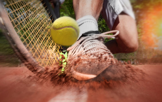 Tennis player on clay tennis court