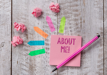 Conceptual hand writing showing About Me. Concept meaning telling someone list of your good and bad properties Note paper and line arrow stickers on the top of wooden table desk