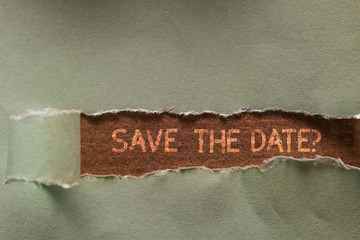 Word writing text Save The Date question. Business photo showcasing asking someone to remember specific day or time Long hole sheet blank paper wrapped paper tear. Wooden table background