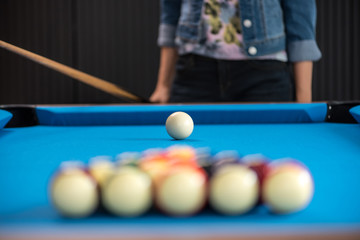 woman hand holding snooker stick playing pool or billiards