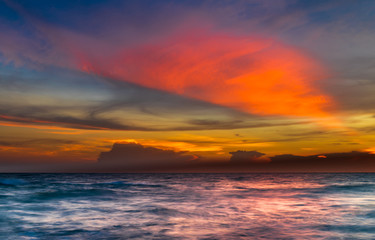 Seascape with sunset sky.