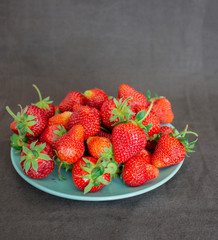 Fresh strawberries. Strawberry background. Macro texture. big, big strawberries. On a dark background. Harvesting clean local strawberries.