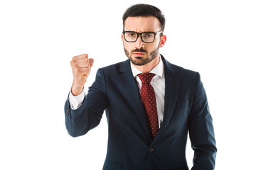 angry businessman showing fist while looking at camera isolated on white