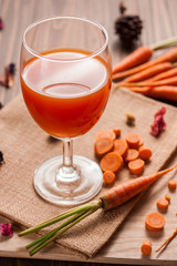Glasses of carrot juice on sack