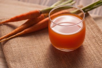 Glasses of carrot juice on sack