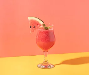 Foto auf Acrylglas Fresh water melon juice and watermelon slice on color background. summer drink. © NaMong Productions