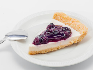 blue berry cheesecake on white background
