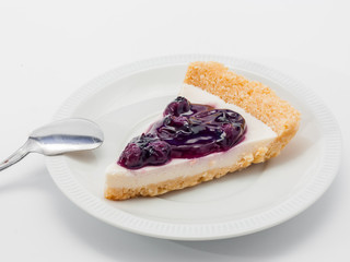 blue berry cheesecake on white background