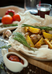 baked potatoes with rosemary garlic sauce vegetables and wine