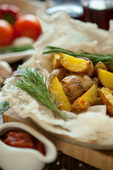 baked potatoes with rosemary garlic sauce vegetables and wine