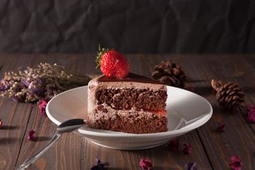 Chocolate strawberry cake on wood boad