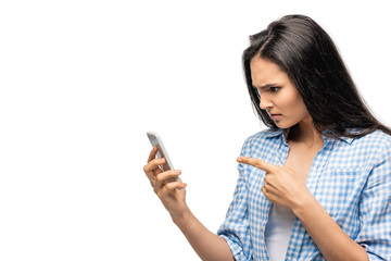 confused girl pointing with finger at smartphone Isolated On White