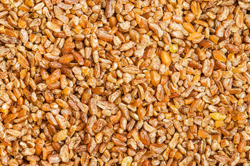 Dry bulgur wheat grains.