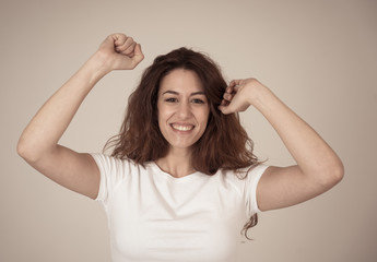 Fototapeta premium Surprised happy woman with red hair celebrating success victory or great sales
