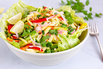 Thai Raw Mango Salad with Roasted Peanuts Served in a White Bowl. Summer Food, Healthy Eating, Seasonal Fruit, .Vegan Food Photography..