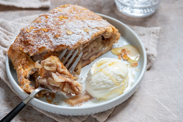Sweet apple strudel with vanilla ice cream