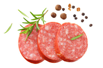 sliced sausage salami with rosemary and peppercorns isolated on white background. top view