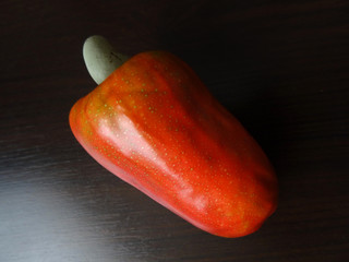  Macro image of a red yellowish cashew apple. A tropical fruit that produces the cashew seed.The species is native to Central America, the Caribbean Islands, and northern South America.   