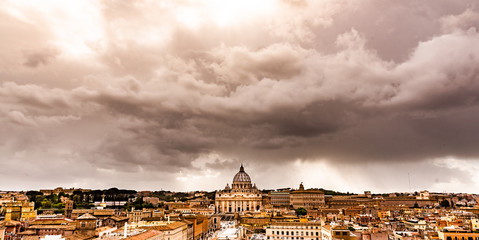 Dramatic clouds above Vatican City with St. Peter's Basilica. Panoramic skyline view from Castel...