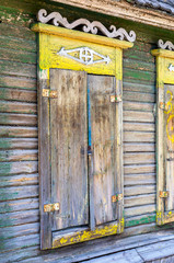 Wooden shutters on the windows of the old house