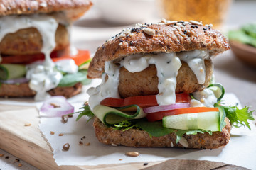 Gourmet Fish seafood burger with mayo and fresh vegetables