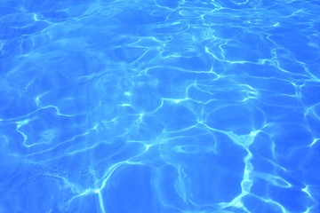 Blue ripped water in the swimming pool Swimming pool water surface background