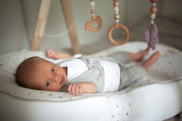 newborn baby sleeps in special mattress device