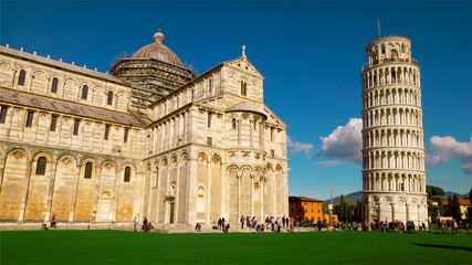 Tourists at Cathedral and Leaning Tower of Pisa in Italy