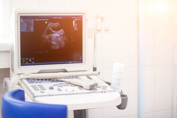 Closeup Ultrasound scanner equipmentin in clinic hospital. Diagnostics, sonography and health concept. Copyspace